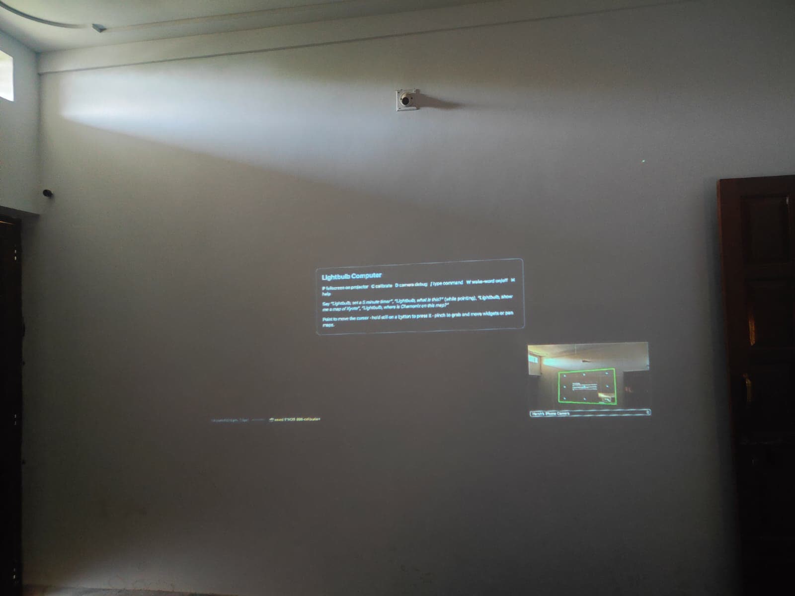 The projection on the wall, with the camera's view of it in the corner
